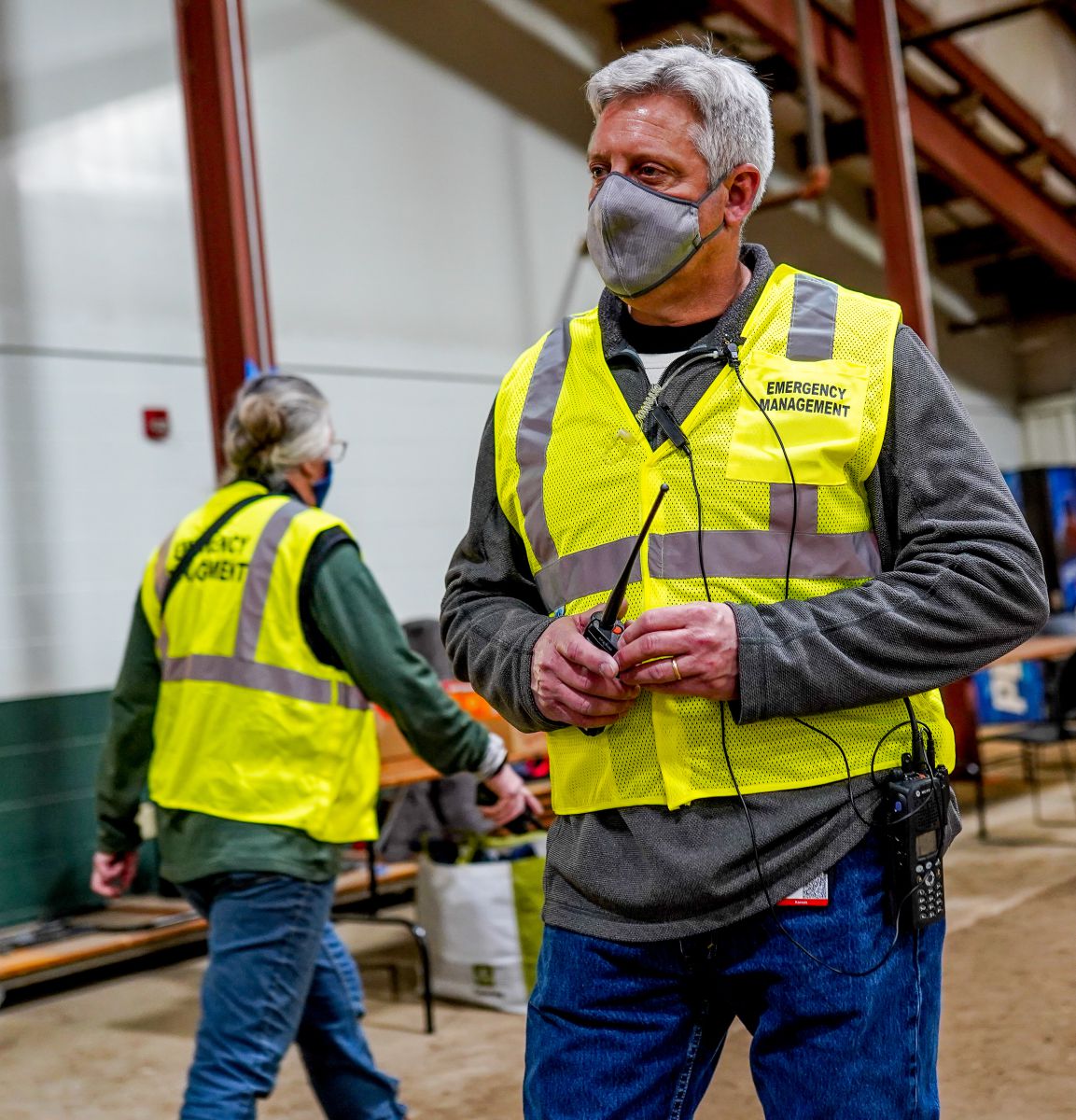 Emergency Management Director Robert Bieniecki is pictured working in February during a drive-through COVID-19 vaccination clinic at the Douglas County Fairgrounds.